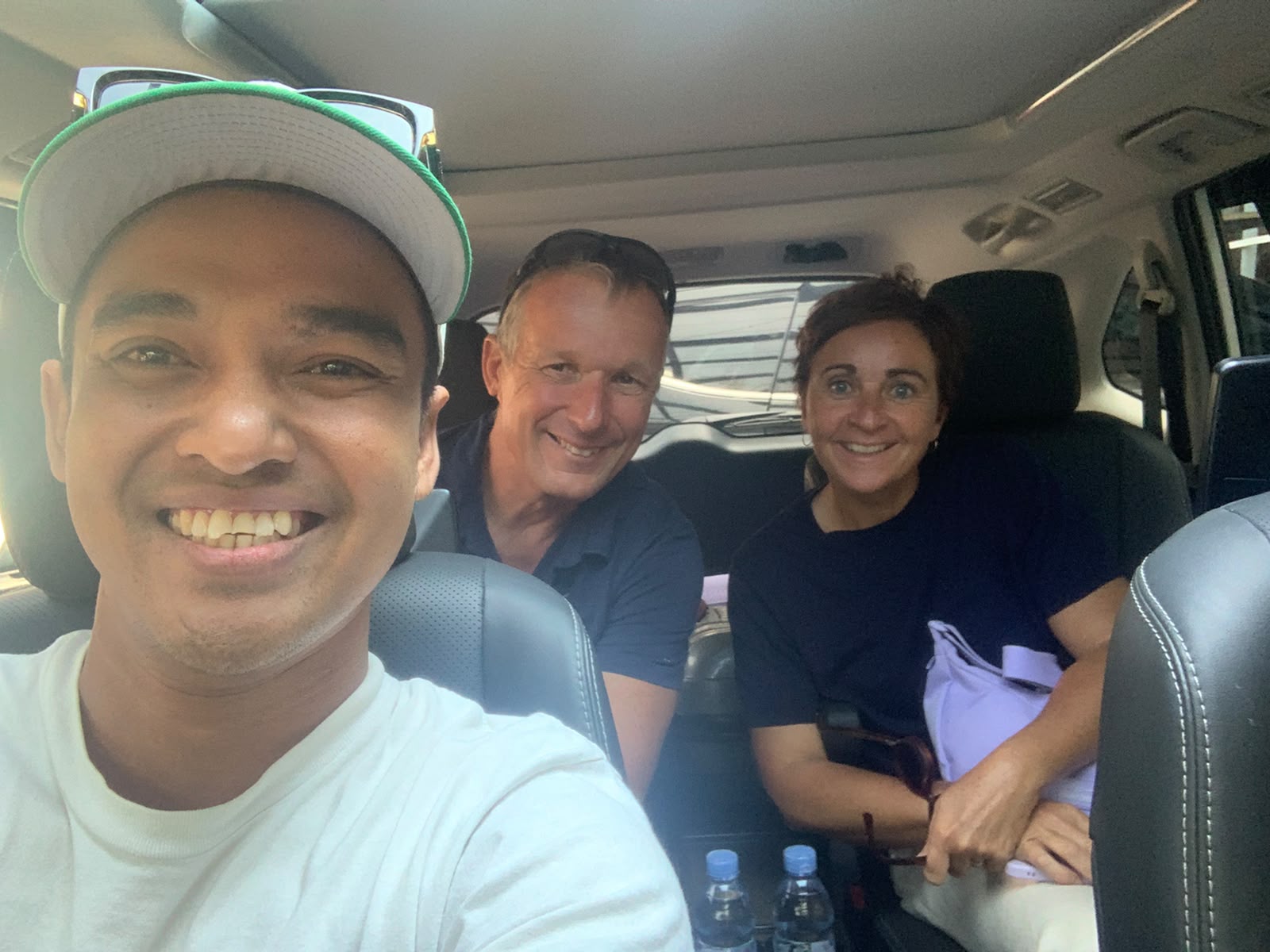 Prof. P. Martin Pai and his wife from Australia inside the Innova Zenix with their Opjar Auto Rent driver